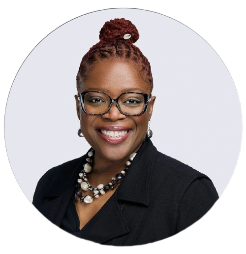 Professional portrait of Janelle in a black jacket and glasses